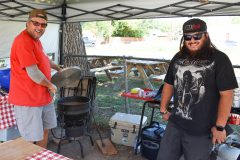 Mike Olguin and his son, Matthew Olguin, proudly show-off their homemade chili at the Ignacio Community Chile-Fest held at Farmers Fresh on Saturday, Sept. 2 — the city plans to hold this event annually. 