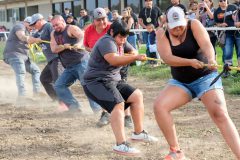 Helltown Hustlers from Ignacio, Colo. puts the pressure on as they pull with all their strength during the Tug-O-War compitition. Helltown Hustlers team placed first in the Tug-O-War open contest on Saturday, Sept. 10. 