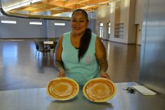 Daisy Bluestar shows her finished pumpkin pies after the pie making workshop held at the Multi-Purpose Facility, Monday, Oct. 16. Denise Thompson taught the program.