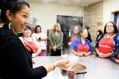 Dawn Manuelito, Health & Wellness Educator for Southwest Partnership with Native Americans, shows the class the finished product before they get ready to can it, during the Cultural Canning Class on Wednesday, Sept. 27 at the Southern Ute Cultural Center.