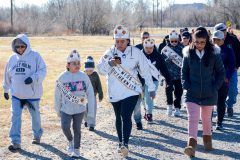Southern Ute Royalty leads participants along the bear trail during the mile walk.