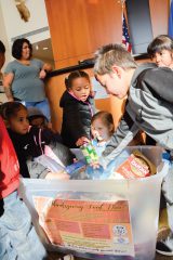SUIMA students put their donations into the food drive bin at the Hall of Warriors, Thursday, Nov. 16. 