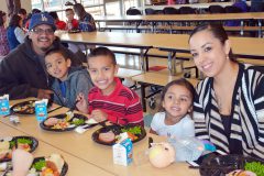 The Richards family enjoys a meal at the annual Ignacio Elementary School Christmas luncheon, Wednesday, Dec. 13. Ignacio High School students volunteered their time to help serve the meals at both the Ignacio Elementary and Middle schools.