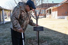 Jimmy Newton Sr. takes a moment to reflect, while admiring the bronze plaque honoring his son, the late Southern Ute Chairman, Jimmy Newton Jr., Tuesday, Dec. 19. 