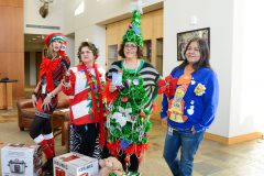 Ugly sweater contest winners: Lisa Smith, Sarah Taylor, Constance Lehi (overall 1st place) and Louise Jack receive their prizes for funniest, most creative and most original as well as an overall winner.