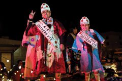 Miss Southern Ute Lorraine Watts and Little Miss Southern Ute Myla Goodtracks ride the royalty float along Main St., for the annual Snowdown Light Parade, held Friday, Feb. 9, in Durango, Colo. 