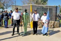 Southern Ute Veterans Association Commander Howard D. Richards Sr., members Gordon Hammond and Rudley Weaver stand beside the statue of Ira Hayes at the Ira Hayes Memorial Park in Sacaton, Ariz.