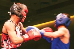 Lawrence Toledo (red) represents his hometown boxing club, The Ring of Champions, with a big win during the Fighting for Change, #stopbullying, boxing event that was held at the Sky Ute Casino Events Center Saturday, March 3.