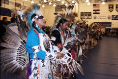 After a round of competition, the mens northern traditional dancers stand together at the 54th Annual Hozhoni Days Powwow on Saturday, April 14. 

