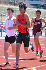 Ignacio sophomore Elco Garcia, Jr., joins the leaders in the 1,600-meter run during the recent Pine River Invitational (Saturday, April 14) inside Bayfield’s Wolverine Country Stadium.  He would place third, clocking 5 minutes, 3.79 seconds, but broke the five-minute barrier even more recently in Aztec, N.M.