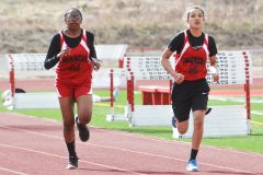 Ignacio Bobcats, Lexi Young and Avaleena Nanaeto keep a steady, strong pace as they run the 400-meter race.

