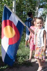 Head Start graduates, Addison Quintana and Lyla Smith carry in the Colorado State flag before the graduation celebration began on Wednesday, May 23 in the courtyard of the Southern Ute Museum. 

