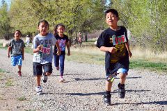 Right out of the gate SUIMA’s lower elementary students run the first part of the triathlon on the Bear Trail located south of SunUte Field.