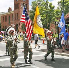 The Southern Ute Veterans Association attended the 12th Annual Flagstaff Armed Forces Day parade in Flagstaff, Ariz. on Saturday, May 19. Raymond Baker (left) carrying the American Flag, Gordon Hammond Ute Mountain Ute Tribal Flag, and Rudley Weaver Southern Ute Tribal Flag. Not pictured Howard Richards Sr. 