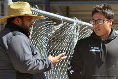 Ignacio Track & Field boys’ head coach John Gurule (left) strategizes with recently graduated thrower Natoni Cundiff during the 2018 season. Coaching aids any athlete’s success, and IHS will welcome one at the end of July for a special jumper-oriented summer camp.