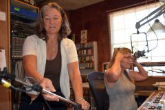 KSUT Executive Director, Tami Graham, concentrates on moving a worn microphone stand into position prior to an interview hosted by Stasia Lanier, with KSUT Tribal Radio Program Manager, Sheila Nanaeto and KSUT Board Vice-President, Robert Ortiz as part of the three-day on-air fund drive.