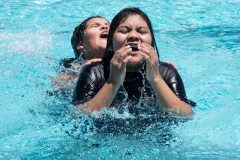 Jaelon Velasco and Trena Height splash and play in the outdoor pool of the Bloomfield Aquatic Center on Monday, June 25. 

