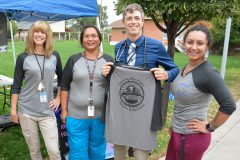  Diabetes Patient Coordinator, Lisa Smith, Diabetes Patient Coordinator, Shaw Marie Tso, Chief Medical Officer, Dr. Finn, and Diabetes Program Coordinator, Morgann Box model the T-shirts that were given away prior to the Breastfeeding Awareness Walk.
