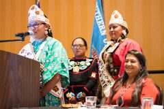 Jr. Miss Southern Ute Autumn Sage greets the NAFWS attendees while Southern Ute Chairman Christine Sage, Miss Southern Ute Lorraine Watts and Southern Ute Brave Dominick Goodtracks watch on. 