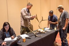 Working together with Aran Johnson and Danielle Austin from Southern Ute Wildlife, officials from the Jicarilla Apache Tribe lend their expertise to Wednesday night’s annual scoring event, hosted by Southern Ute Division of Wildlife, August, 22 at the Sky Ute Casino Resort. 