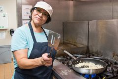 Southern Ute Multi-Purpose Facility Operations Manager, Elise Redd cooks up some potatoes for the senior breakfast that was open to the community, Friday, Aug. 3, in the Multi-Purpose Facility’s kitchen. 