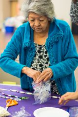 Evelyn Russell packs away her supplies after making a Christmas ornament at the Arts & Crafts Fair on Saturday, Sept. 1. 