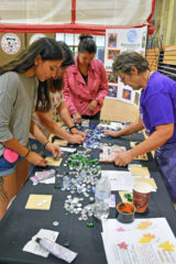 Leela Rosa and Stacy Oberly make personalized tiles with Kasey Corriea of Dancing Spirit Gallery Community Arts Center.


