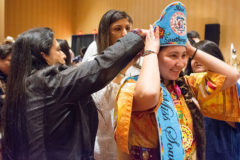 The Southern Ute Royalty committee adorned the 2018-2019 royalty with brand new sashes and beaded crowns at the Thanksgiving Dinner. Chairman Christine Sage and Councilwoman Lorelei Cloud help Miss Southern Ute, Jazmine Carmenoros with tying her new crown. 
