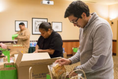 The Southern Ute Cultural Preservation team: Garrett Briggs, Kree Lopez and Xavier Watts fill the Christmas candy bags for the membership with popcorn, fresh fruit and chocolates on Wednesday, Dec. 12 at the Sky Ute Casino Resort. 