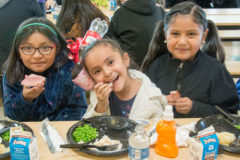 Layla Height, Ashley Sandoval and Bianka Velasquez sit together while eating a festive Christmas lunch in the Ignacio Elementary School cafeteria on Thursday, Dec. 20.

