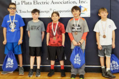 Thunder Windy Boy (center) attended and won the Regional Elks Hoopshoot free throw contest Jan. 20, at FLC.  He represented the Durango area for boys 8-9-year-old division after winning the local Hoopshoot on Dec. 15, at Escalante Gymnasium.  