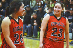Ignacio’s Ebonee Gomez (23) and Monica Lucero (20) share a laugh during the Lady Bobcats’ 55-17 road win at Ouray Saturday afternoon, Feb. 9.  The victory kept IHS unbeaten against all SJBL opposition, with just one regular-season league game remaining.