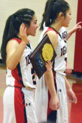 Holding the first-place plaque, Ignacio senior Kiana Valdez (2) bids fans adieu after the Lady Bobcats defeated Dolores 57-23 to win the 2A-District 3 Tournament Sunday afternoon, Feb. 24, inside 4A Durango’s DemonDome.
