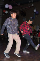 Dewayne Hendren and friend Quentin Baker dance the night away while attending the Valentine’s Dance. 