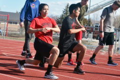 Vanessa Gonzales, left, and Elco Garcia, Jr., lead the Bobcats in stretches prior to practice Wednesday, March 20.  IHS Track & Field will finally see action Saturday, March 30, in Bloomfield, N.M.
