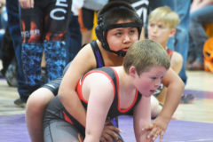 Bayfield Wolverine, Nakai Box readies himself, awaiting the referees whistle to begin the match at the Bayfield Youth Wrestling tournament, Saturday, March 16 in the Bayfield High School Gym.