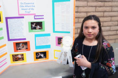 Marissa Olguin proudly holds her third place ribbon for her San Juan Basin Regional Science Fair entry “Do Essential Oils Affect a Dog’s Mood?”