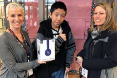 Team KIND members, Lisa Olguin and Robin Duffy-Wirth of SunUte, handed out wireless Beats on Thursday, March 21, to Ernesto Verneno at the Ignacio Middle School. Verneno was the winner of the magnet contest on the lockers in the school.