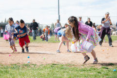 Kids in the 5-8-year-old Easter egg hunt rush to the SunUte Baseball field to grab eggs full of goodies. 

