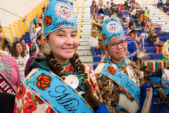 Miss Southern Ute, Jazmine Carmenoros and Jr. Miss Southern Ute, Autumn Sage dance together during Grand Entry of the Hozhoni Days Powwow on Friday, April 12.