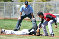 Ignacio’s Gabe Tucson attempts to tag a Meeker runner as part of a pick-off play during neutral-site action Friday, April 19 in Montrose, Colo.