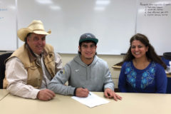 Seen making it official Thursday, April 4, Ignacio senior Dustin Sanchez, flanked at left by father K.C. Hall and at right by mother Jessie Sanchez, will continue his student-athlete career as a Garden City Community College bull rider in Garden City, Kan.