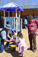 The Southern Ute Indian Montessori Academy celebrated the Easter holiday on Friday, April 19. Southern Ute elder Ramona Eagle and SUIMA student Cassius Harlan watched as his father, Stais Harlan, counted how many eggs were in his basket. Students and their families gathered for an Easter egg hunt on SUIMA grounds for younger students and at SunUte Park for older students. Parents and grandparents were encouraged to participate in helping find Easter eggs alongside the youngest of participants. 