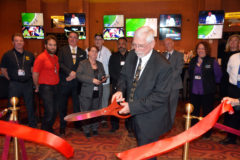Sky Ute Casino Resort General Manager, Charlie Flagg cuts the ceremonial ribbon, during a small ceremony for the 49 Lounge, Friday, May 4 in the Sky Ute Casino Resort. The newly renovated 49 Lounge opens at noon, and patrons can try their luck on the IGT bar-top machines while watching their favorite sporting event on any of the flat screens, or lounge on any of the comfy leather chairs and couches while watching the huge nine-screen monitor display.
