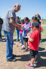 Southern Ute Cultural Education Coordinator, Hanley Frost presents each camper with a pinch of tobacco to offer before he said a prayer. The annual Culture Camp paid a visit to the Southern Ute Bison Ranch on Tuesday, June 11. 