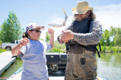 Curtis WhiteThunder attempts to catch the fish that slipped out of Wildlife Fisheries Biologist, Ben Zimmerman’s hands. Zimmerman completed an electroshocking presentation to show the E.L.K.S Program kids and caught multiple species of fish for them to examine and hold on Tuesday, June 11 at Scott’s Pond. 