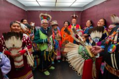 The Box family and relatives squeeze into the elevator dressed in their regalia just before they take to the stage at the Earth’s Call concert on Saturday, May 18 in Aspen, Colo. 
