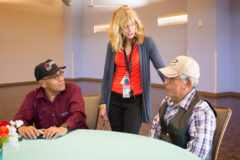 Shining Mountain Health and Wellness Patient Coordinator, Lisa Smith explains the dinner menu to tribal elder Russel Box and Southern Ute Councilman Bruce Valdez at the Elder’s Dinner on Monday, June 10. 

