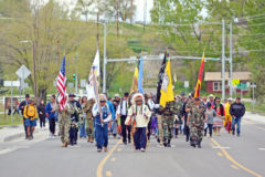 Ute Mountain Ute elder, Terry Knight (USAF) led the procession from the Veterans Memorial Park.