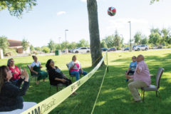 Culture Preservation Director, Edward Box III goes for the hit during the chair volleyball game held at the Elders Dinner, Monday, July 8, at Ute Park.